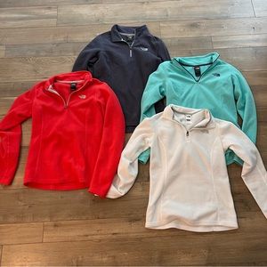 The North Face women’s small half zip-up pullovers FOUR